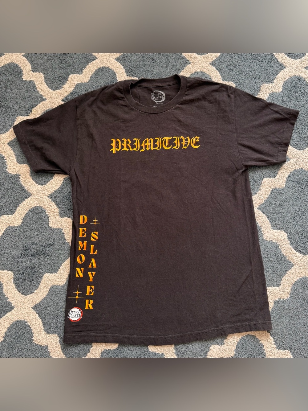 Primitive Black Graphic Tee with Yellow Logo